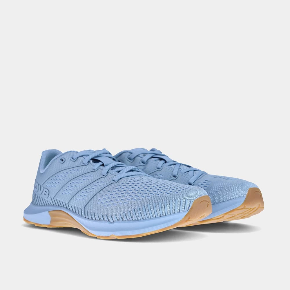 Pair of INOV8 F-Fly training shoes, light blue and grey gum, angled view