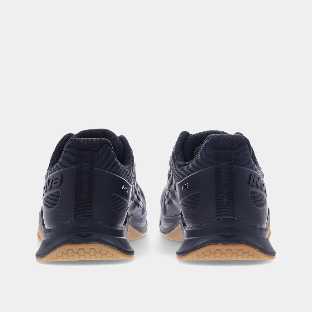 Pair of INOV8 F-Lite training shoes, black and gum, back view