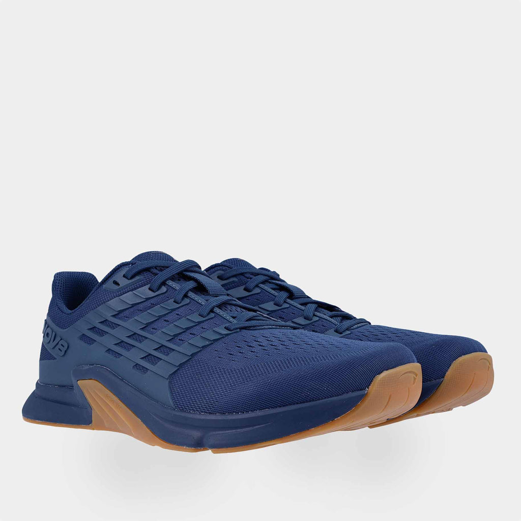 Pair of INOV8 F-Lite training shoes, dark blue and gum, angled view