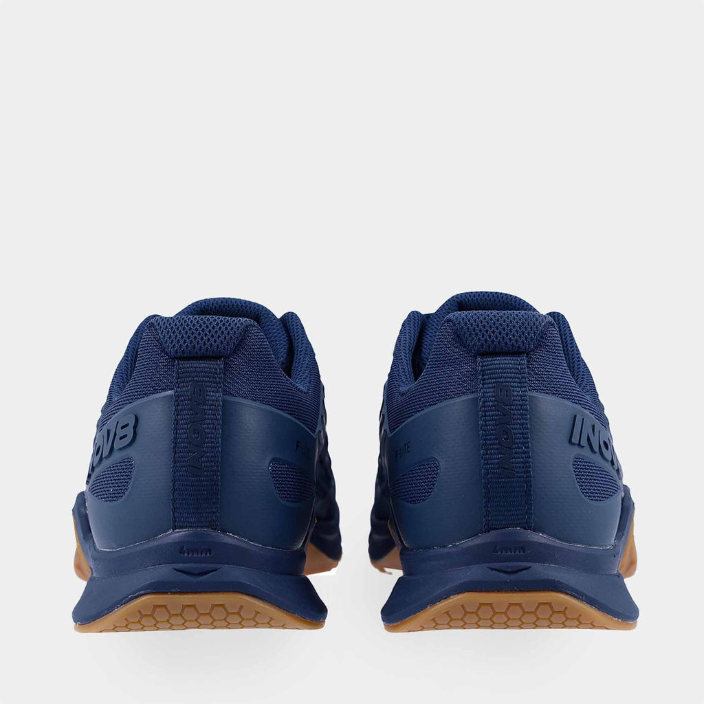 Pair of INOV8 F-Lite training shoes, dark blue and gum, back view
