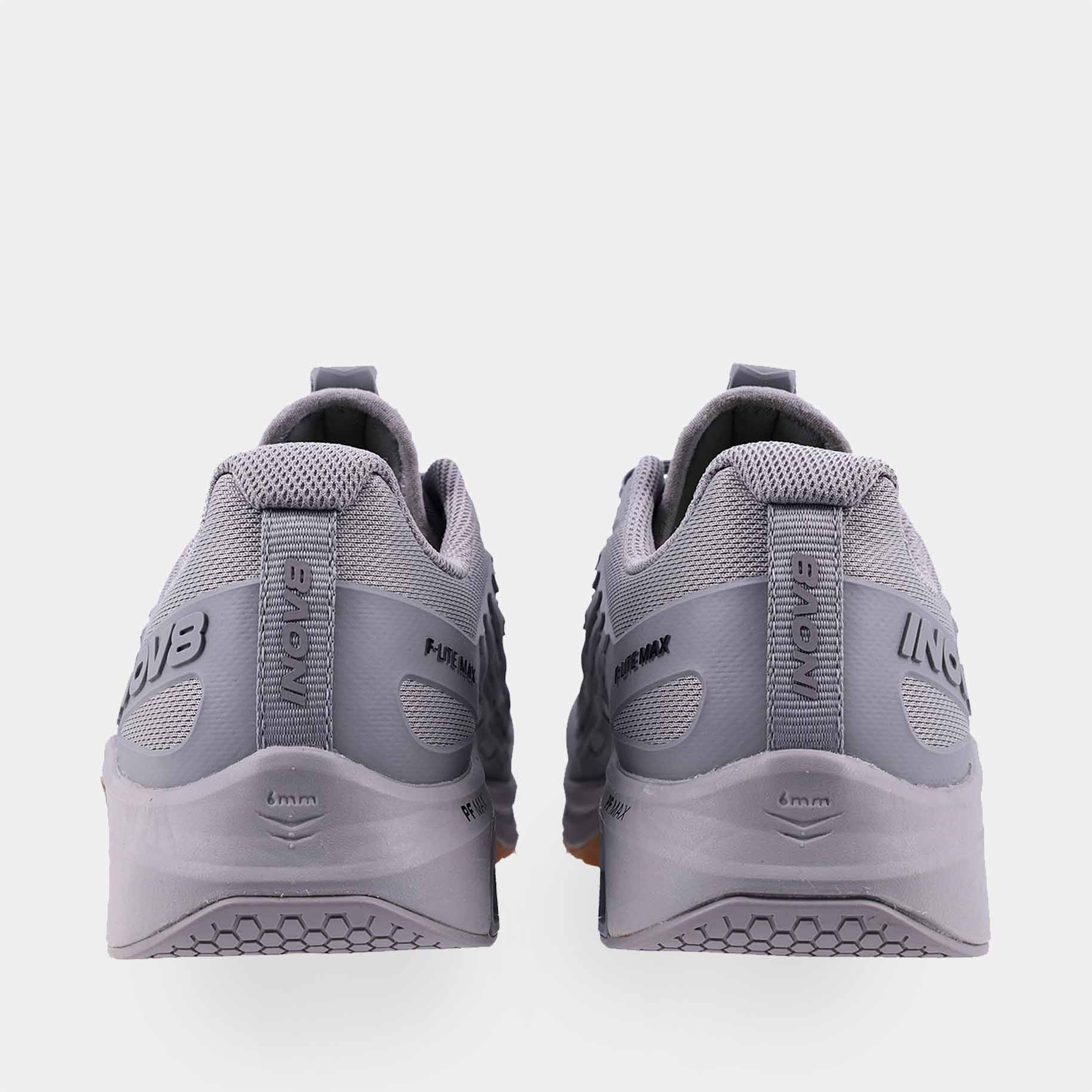 Pair of INOV8 F-Lite Max training shoes, grey and gum, back view