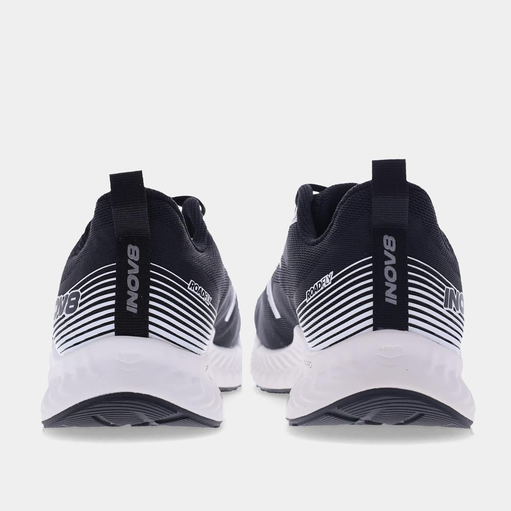 Pair of INOV8 RoadFly road running shoes, black and white, back view