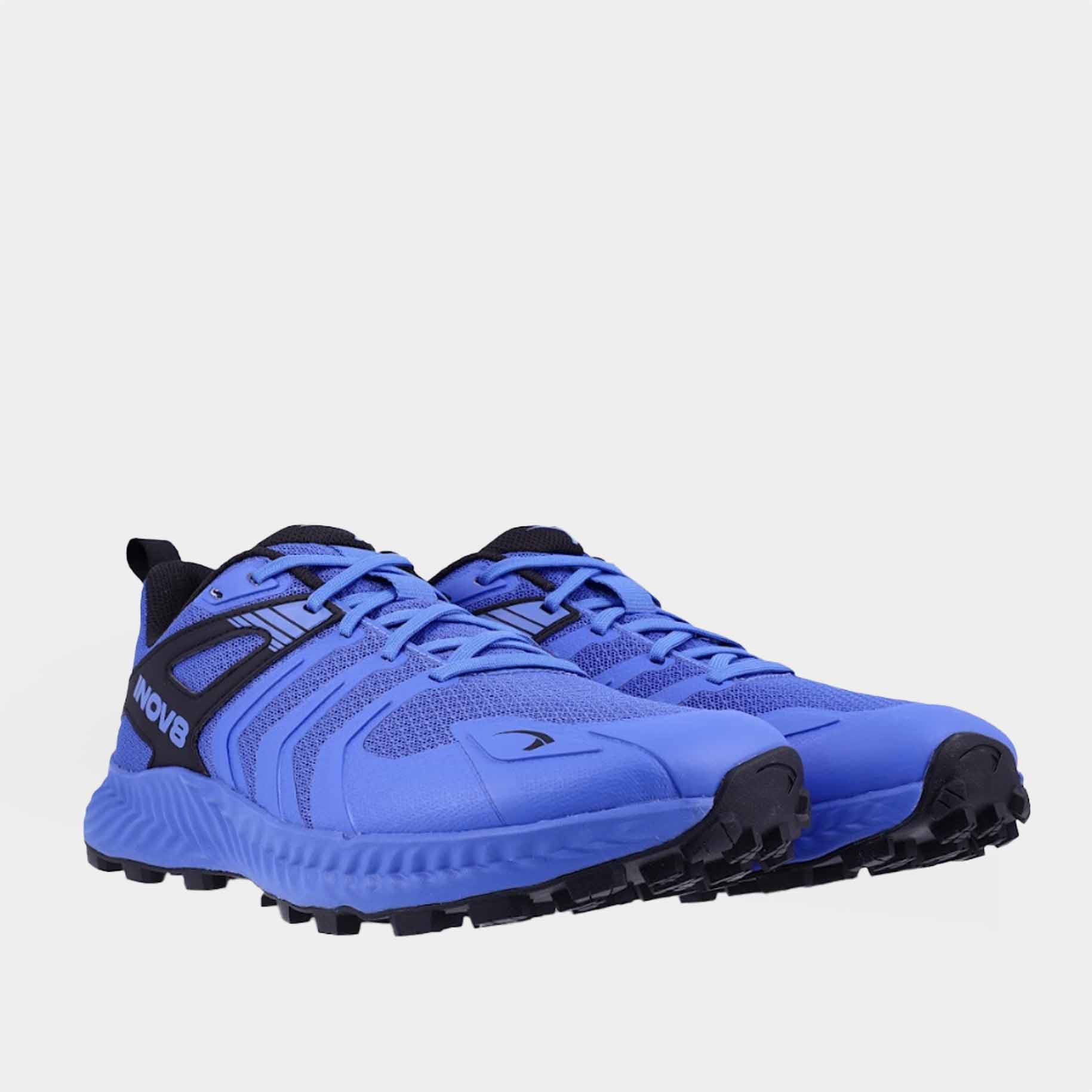 Pair of INOV8 TrailTalon trail running shoes, blue and black, angled view